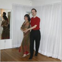 Cynthya and Ben ballroom dancing in red 2005.JPG